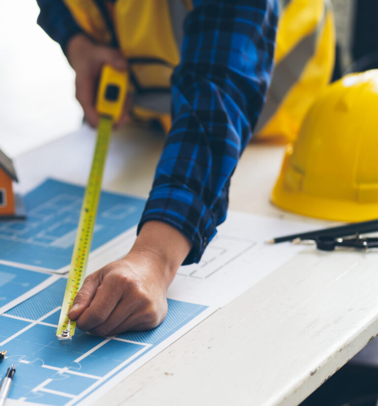 vecteezy_architect-man-working-with-blueprints-engineer-inspection-in_7359664
