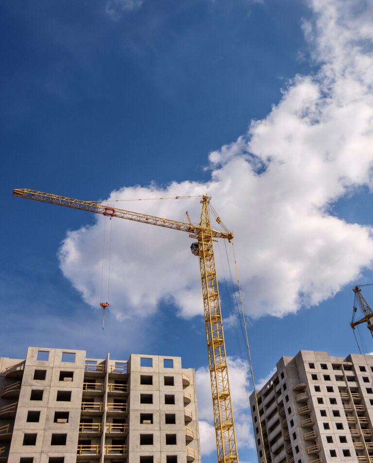 vecteezy_tower-cranes-and-unfinished-multi-storey-high-near-buildings_9830225
